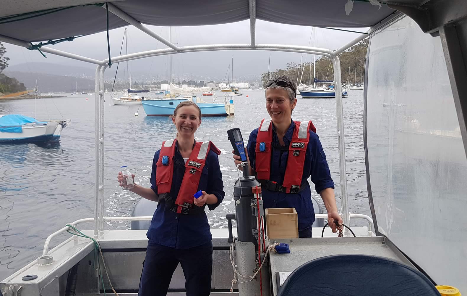 DEP team members Bernadette Proemse and Inger Visby sampling the Derwent in cooperation with the EPA. Photo: Derwent Estuary Program.